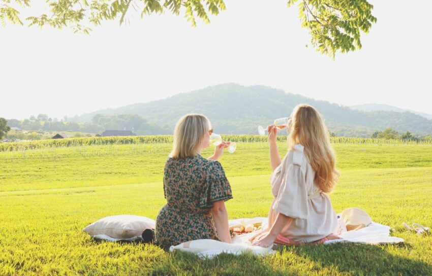 Women sipping wine at Early Mountain